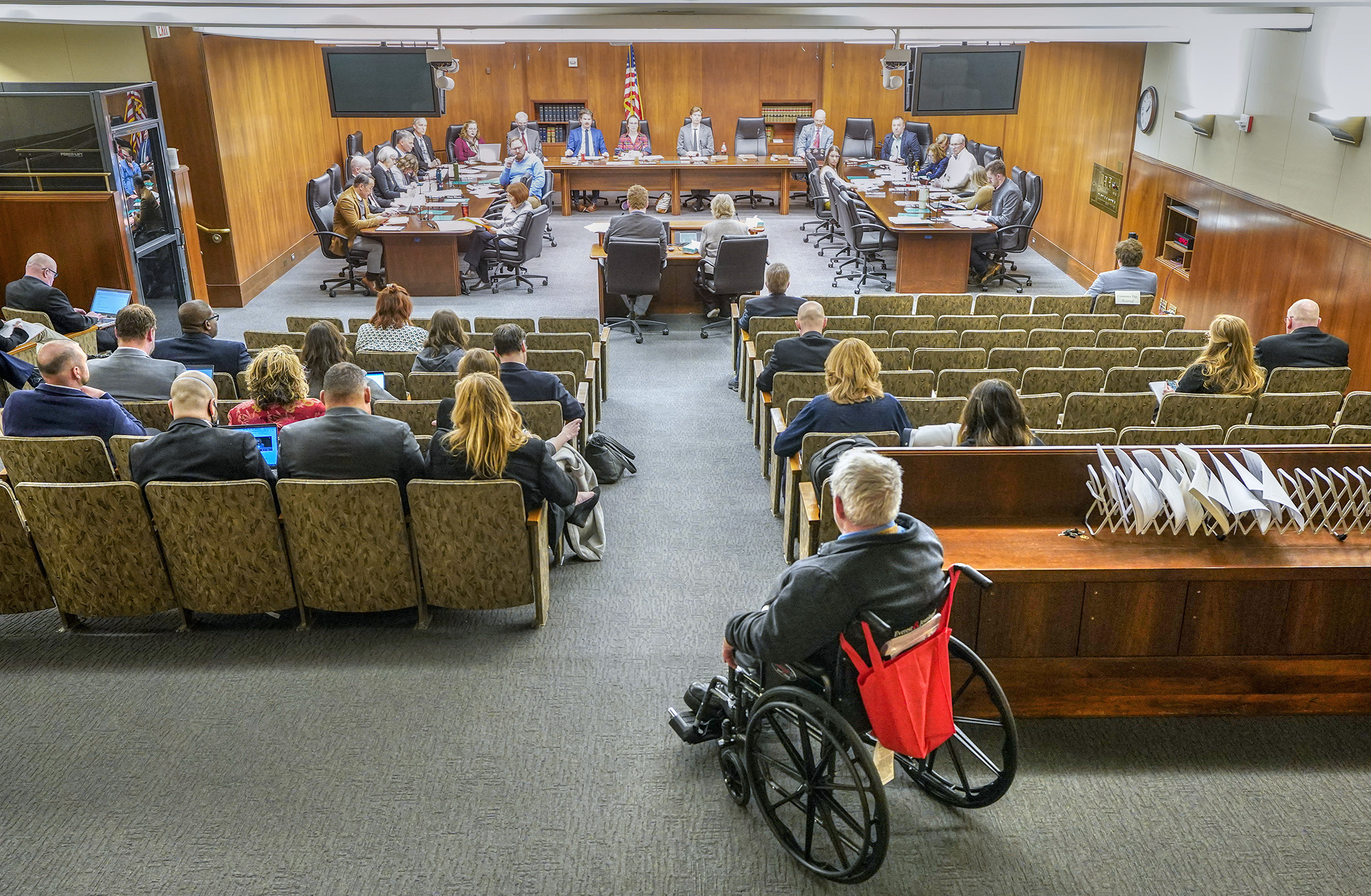 Members of the House Commerce Finance and Policy Committee listen to testimony on the commerce finance bill April 17. (Photo by Andrew VonBank)